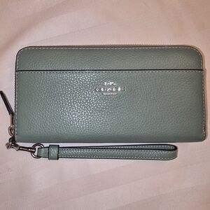 The COACH 6643 Sage Green Pebbled Leather Accordion Zip Around Wallet Wristlet